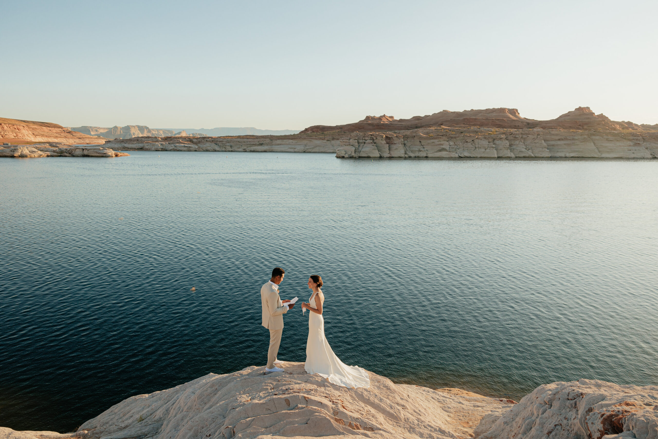 Breathtaking Lake Powell Elopement in southern Utah. A houseboat venue & roaming canyons on their wedding day