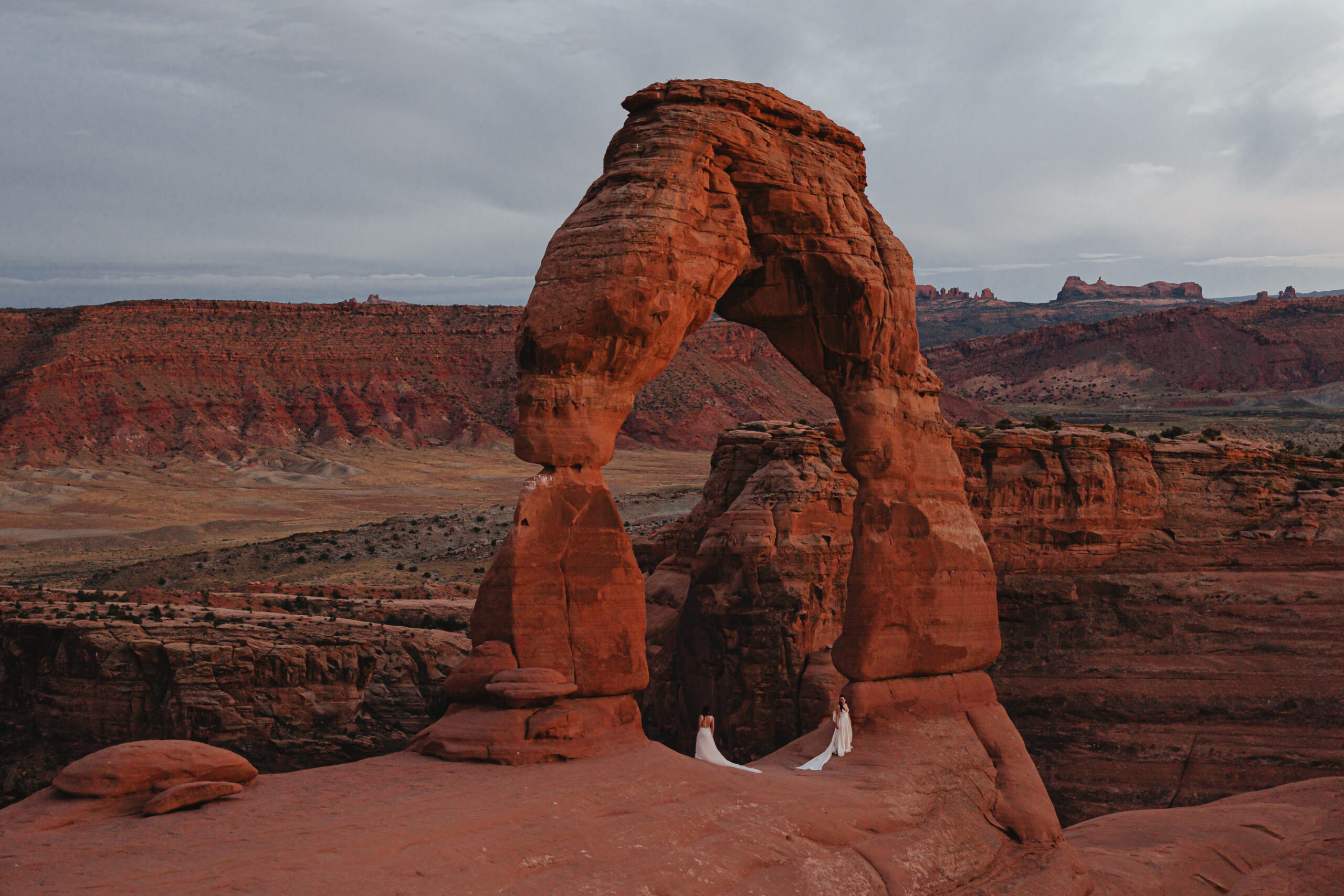 destination wedding with brides in moab utah at under canvas, red earth venue, and arches national park
