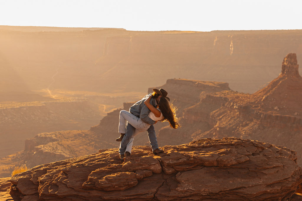 Enjoy this Western Cowboy Desert Adventure in the cliffs of Moab, Utah. Documentary style engagement photos at Canyonlands